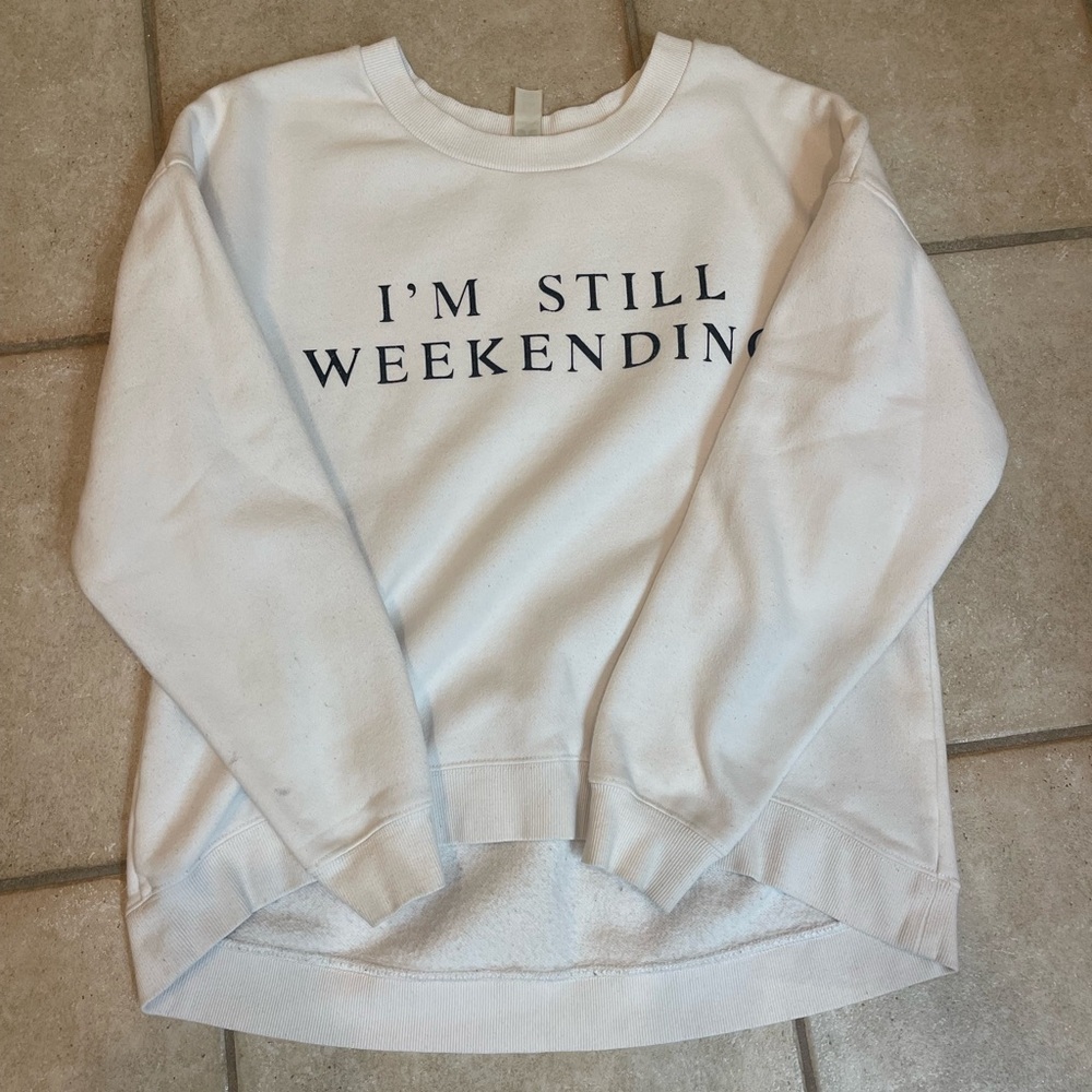 White sweatshirt, brand is GreenTea